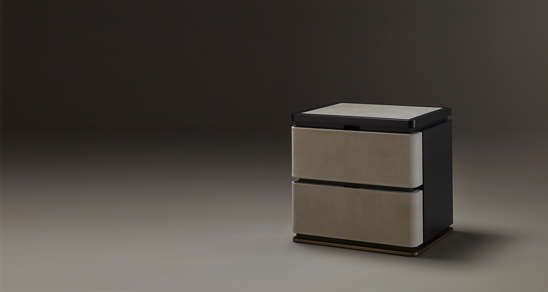 Au Bout de la Nuit is a wooden bedside table with drawers, bronze base and top covered in leather with glass, from Promemoria's Amaranthine Tales collection | Promemoria