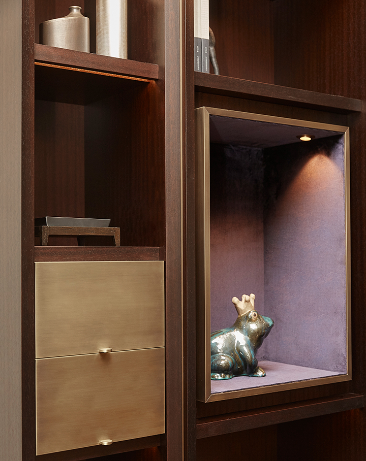 Detail of Nightwood, a wooden modular bookcase with bronze details, from Promemoria's Night Tales collection | Promemoria