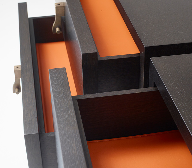 Drawers' detail of Amarcord, a wooden chest of drawers that can have bronze drawer fronts from Promemoria's catalogue | Promemoria