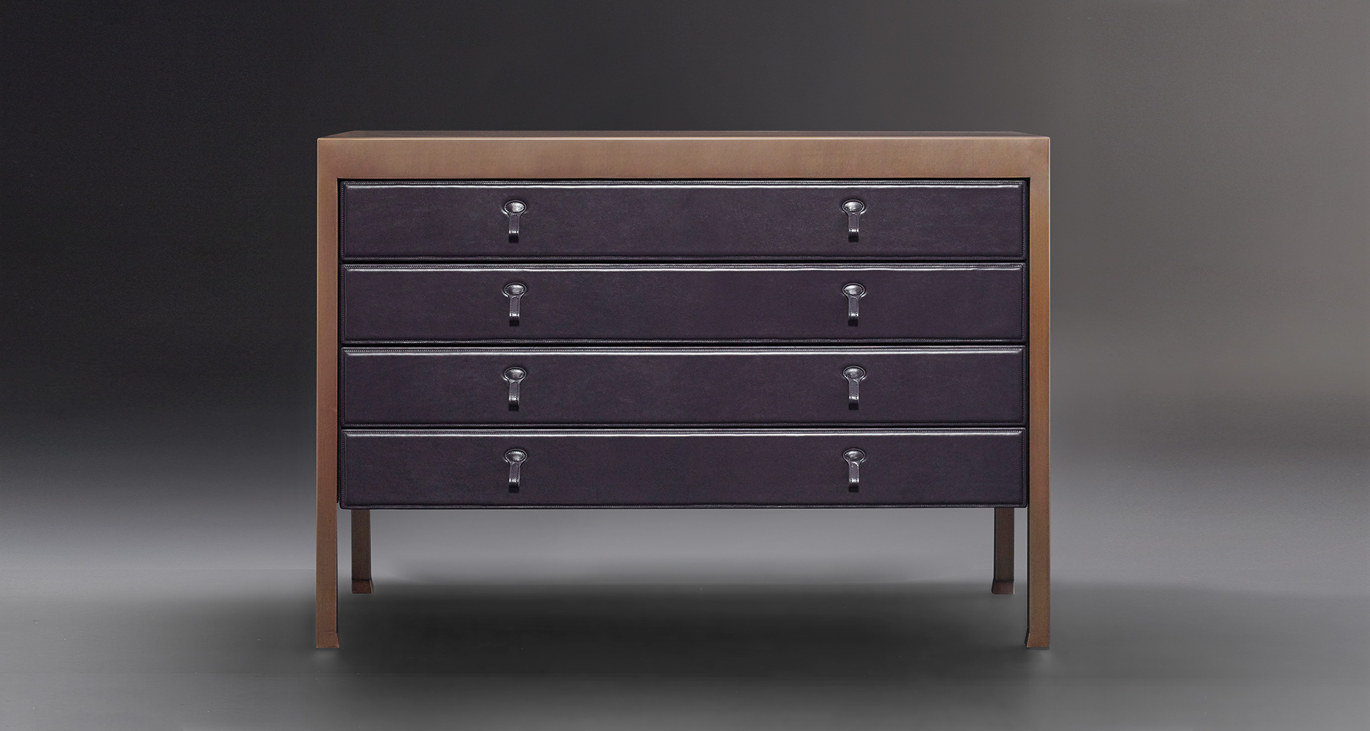Gong is a bronze chest of drawers covered in fabric or leather from Promemoria's catalogue | Promemoria