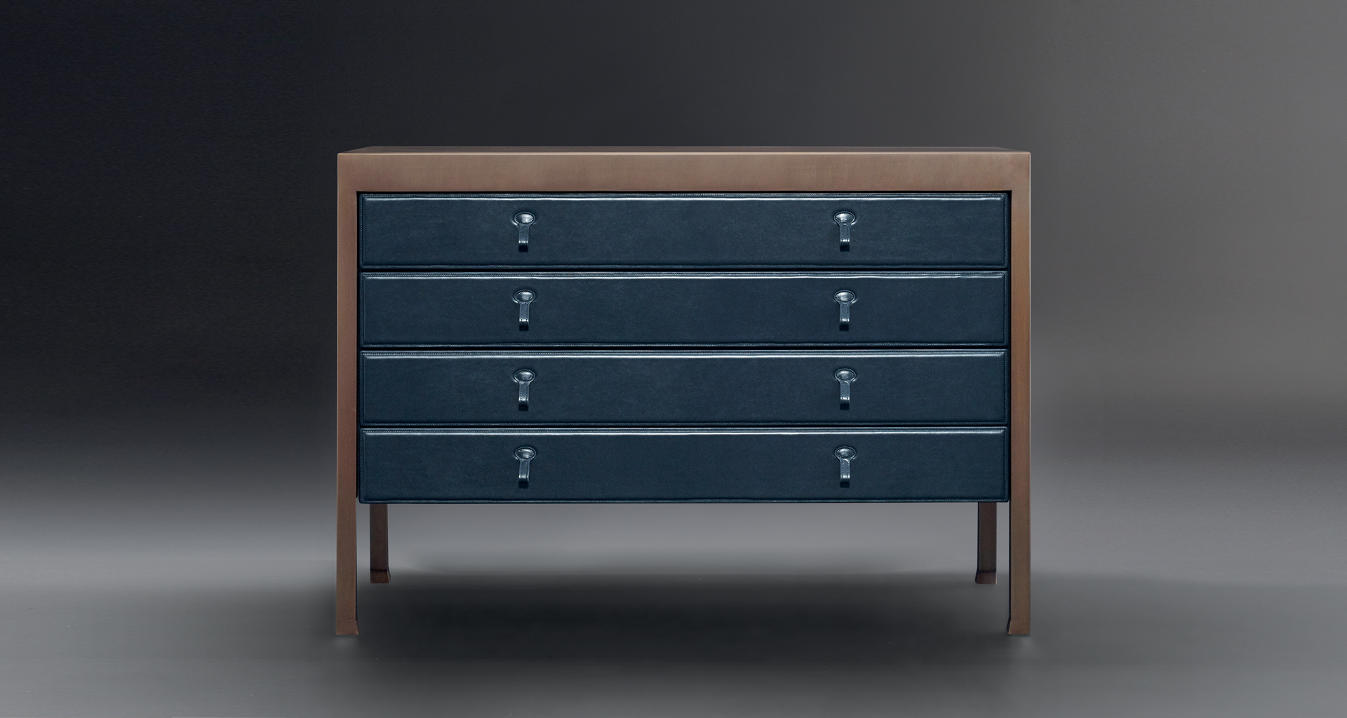 Gong is a bronze chest of drawers covered in fabric or leather from Promemoria's catalogue | Promemoria