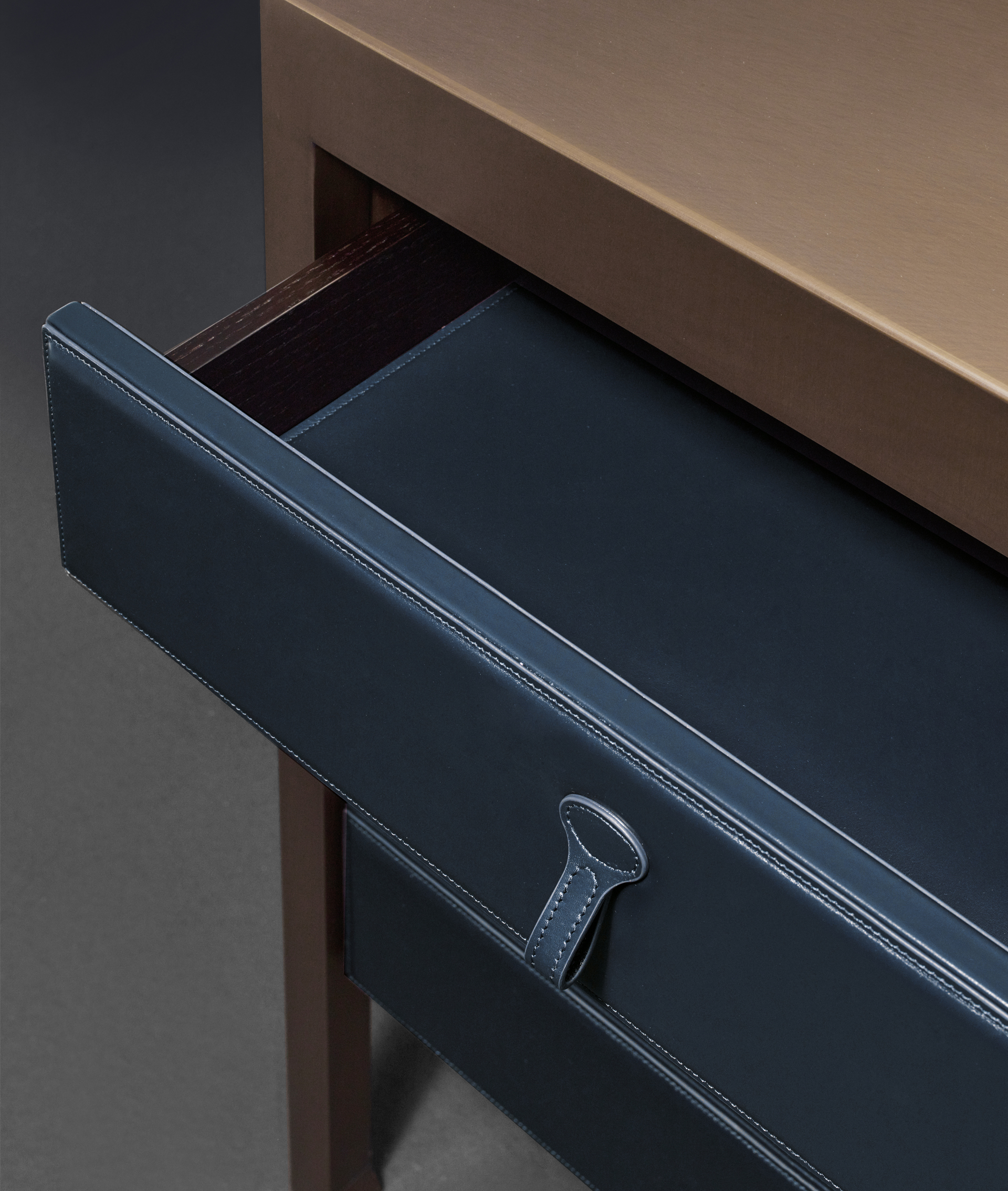 Gong is a bronze chest of drawers covered in fabric or leather from Promemoria's catalogue | Promemoria