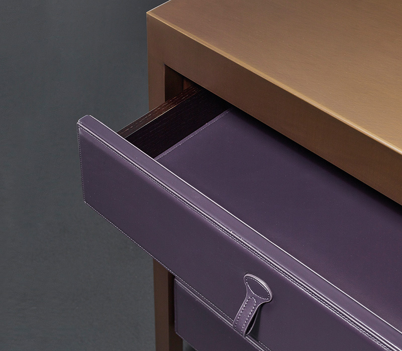 Drawer detail of Gong, a bronze chest of drawers covered in fabric or leather from Promemoria's catalogue | Promemoria