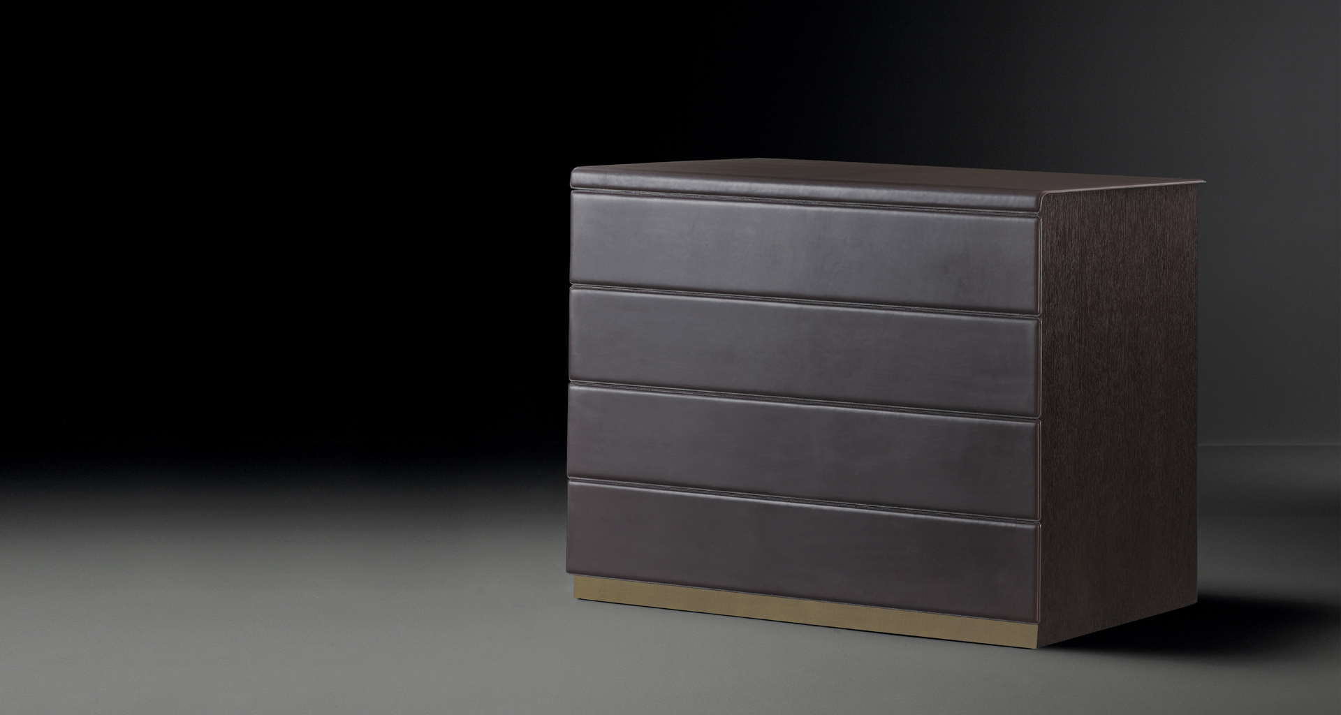 Orione is a wooden chest of drawers covered in leather, from Promemoria's catalogue | Promemoria