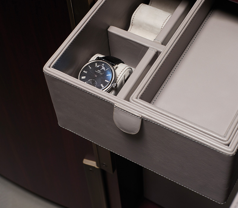 Detail of internal accessories of Alchemico Lui e Lei, two wooden cabinets with bronze details and several internal accessories, from Promemoria's collection Amaranthine Tales | Promemoria