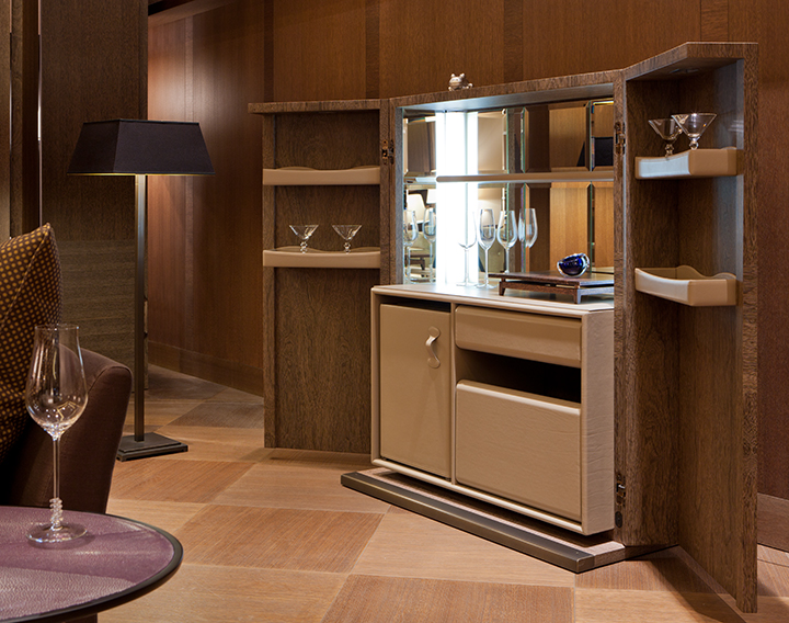 Inside of Bacco, a wooden cabinet-bar with several accessories inside and bronze base, profiles and handles, from Promemoria's catalogue | Promemoria