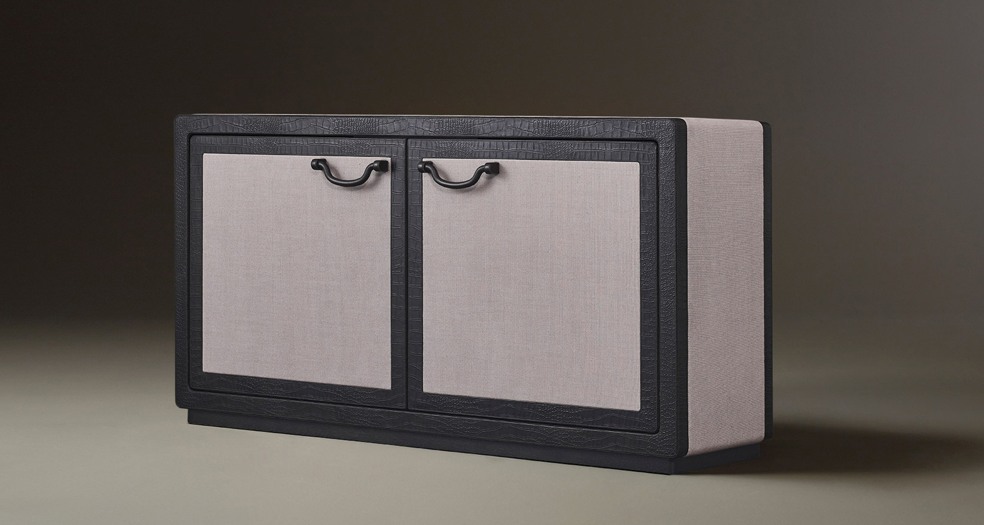 Future Voyager Atto II is a wooden cabinet covered in leather and fabric with handles and placemats in leather from Promemoria's catalogue | Promemoria