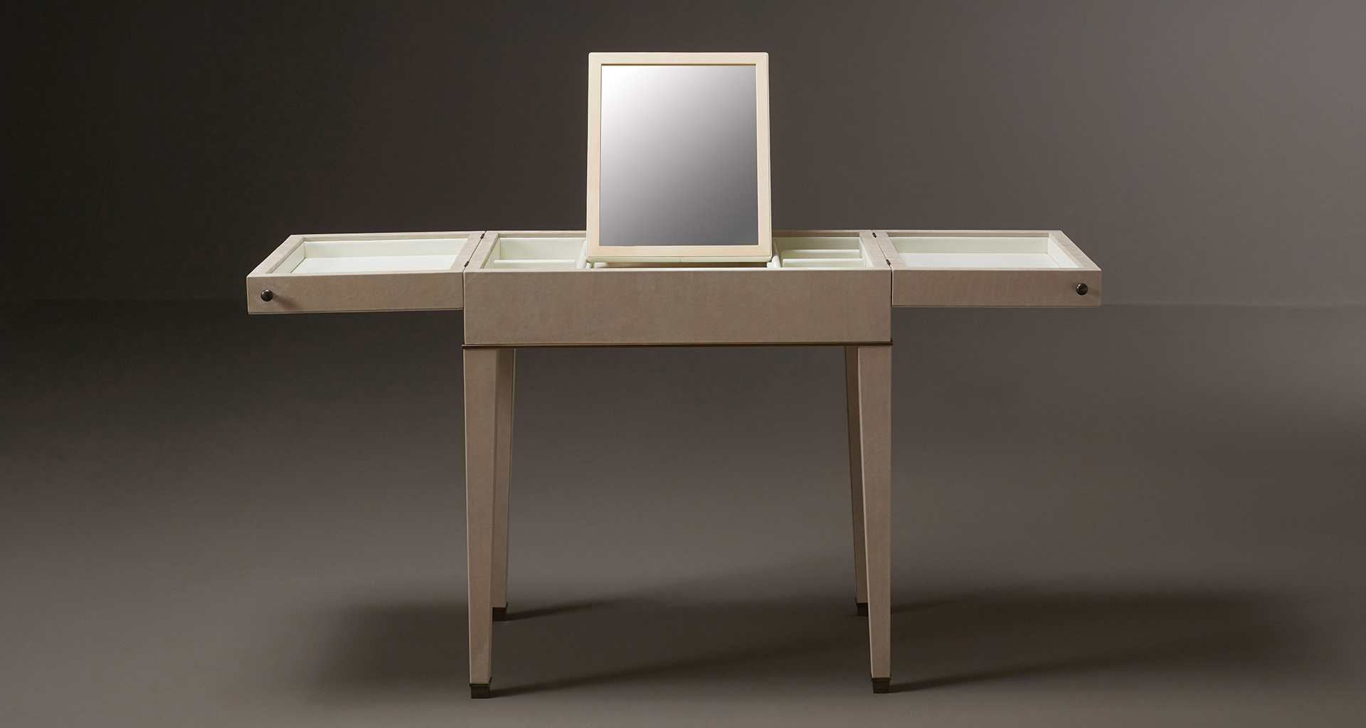 Kalypso is a wooden cabinet with bronze and leather details from Promemoria's collection Amaranthine Tales | Promemoria