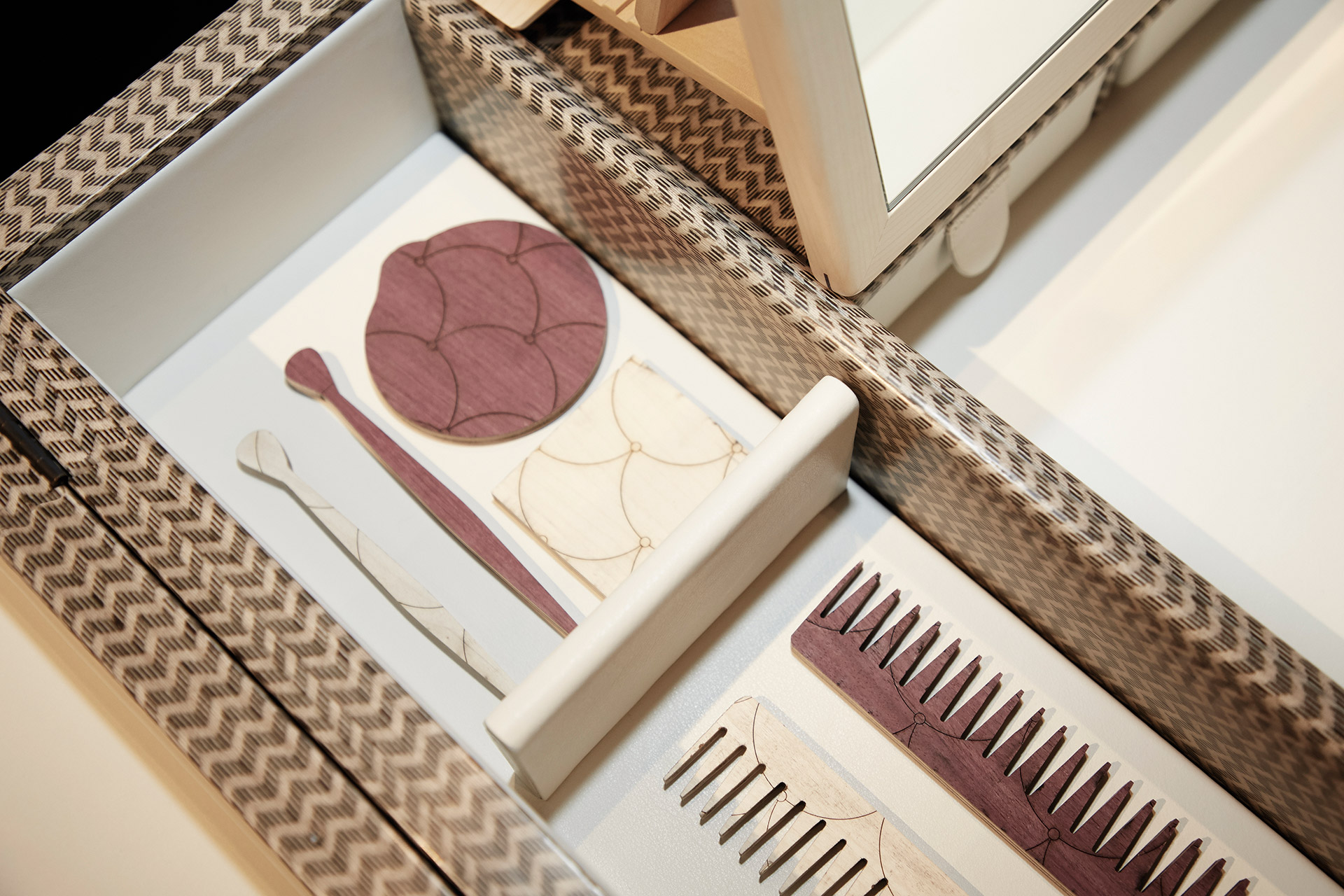 Inside detail of Kalypso, a wooden cabinet with bronze and leather details from Promemoria's collection Amaranthine Tales | Promemoria