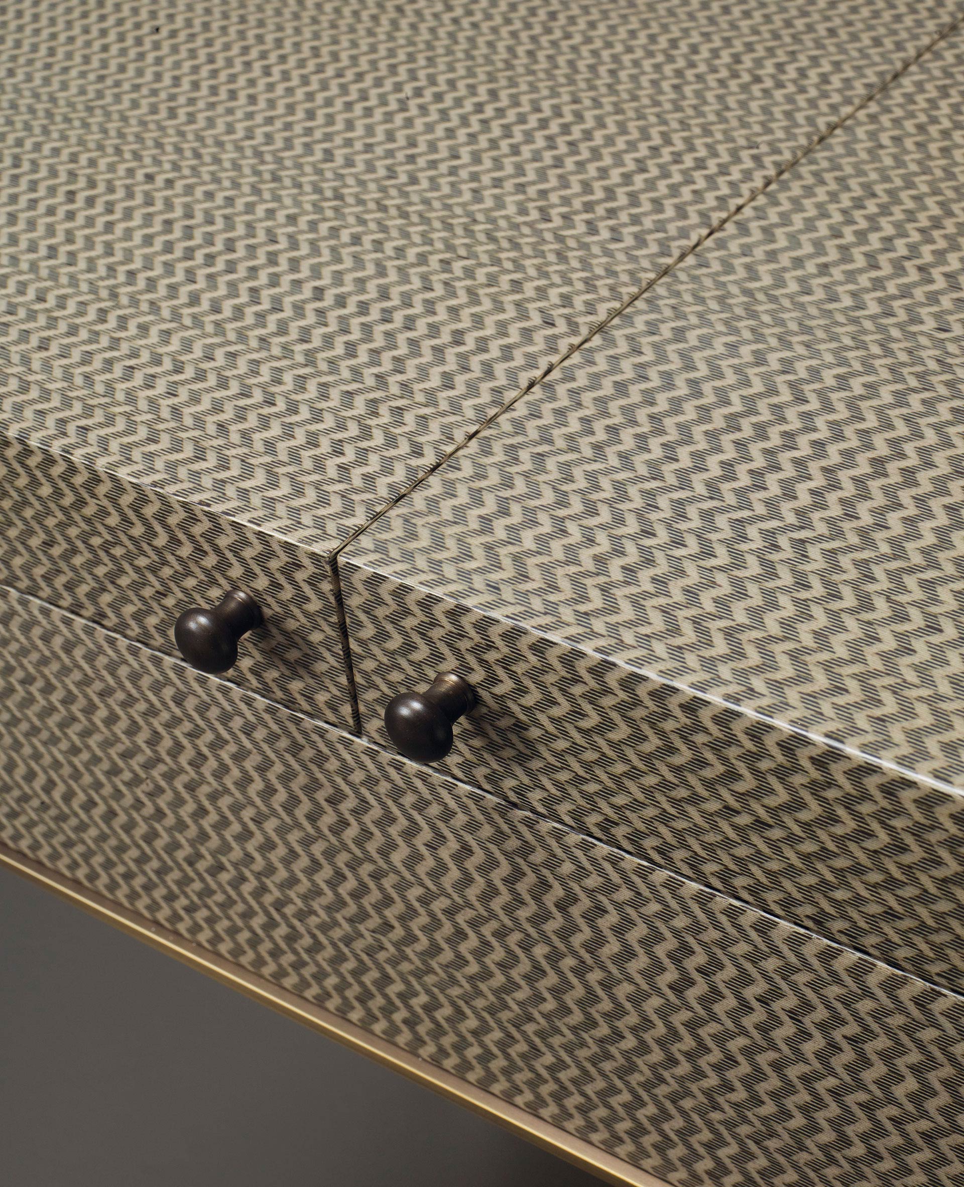 Handles' detail of Kalypso, a wooden cabinet with bronze and leather details from Promemoria's collection Amaranthine Tales | Promemoria