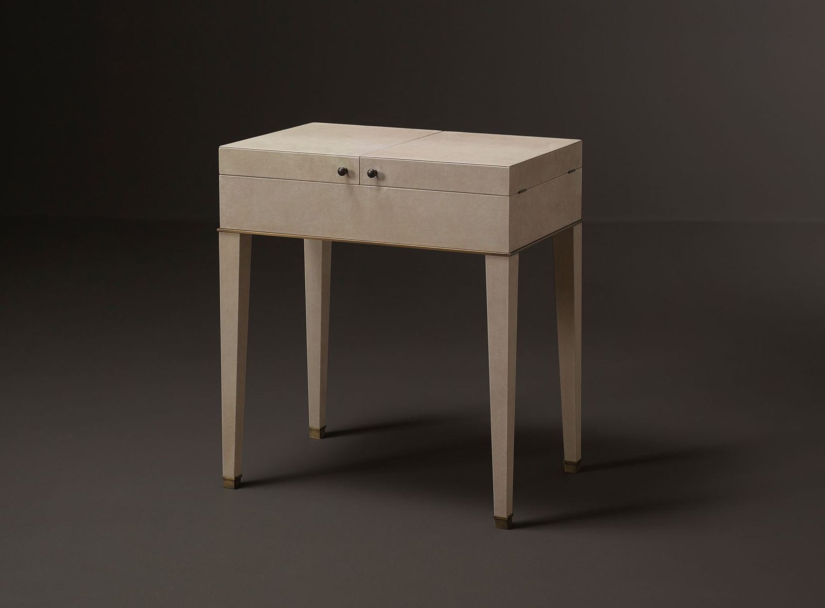 Kalypso is a wooden cabinet with bronze and leather details from Promemoria's collection Amaranthine Tales | Promemoria