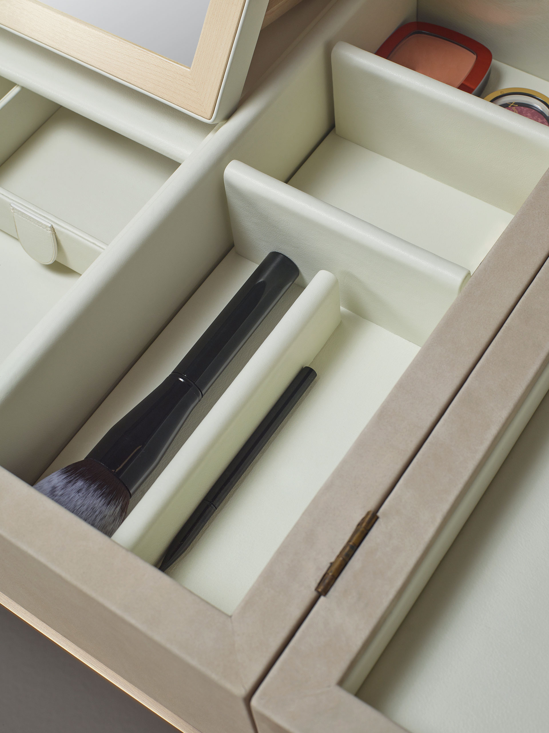 Inside detail of Kalypso, a wooden cabinet with bronze and leather details from Promemoria's collection Amaranthine Tales | Promemoria