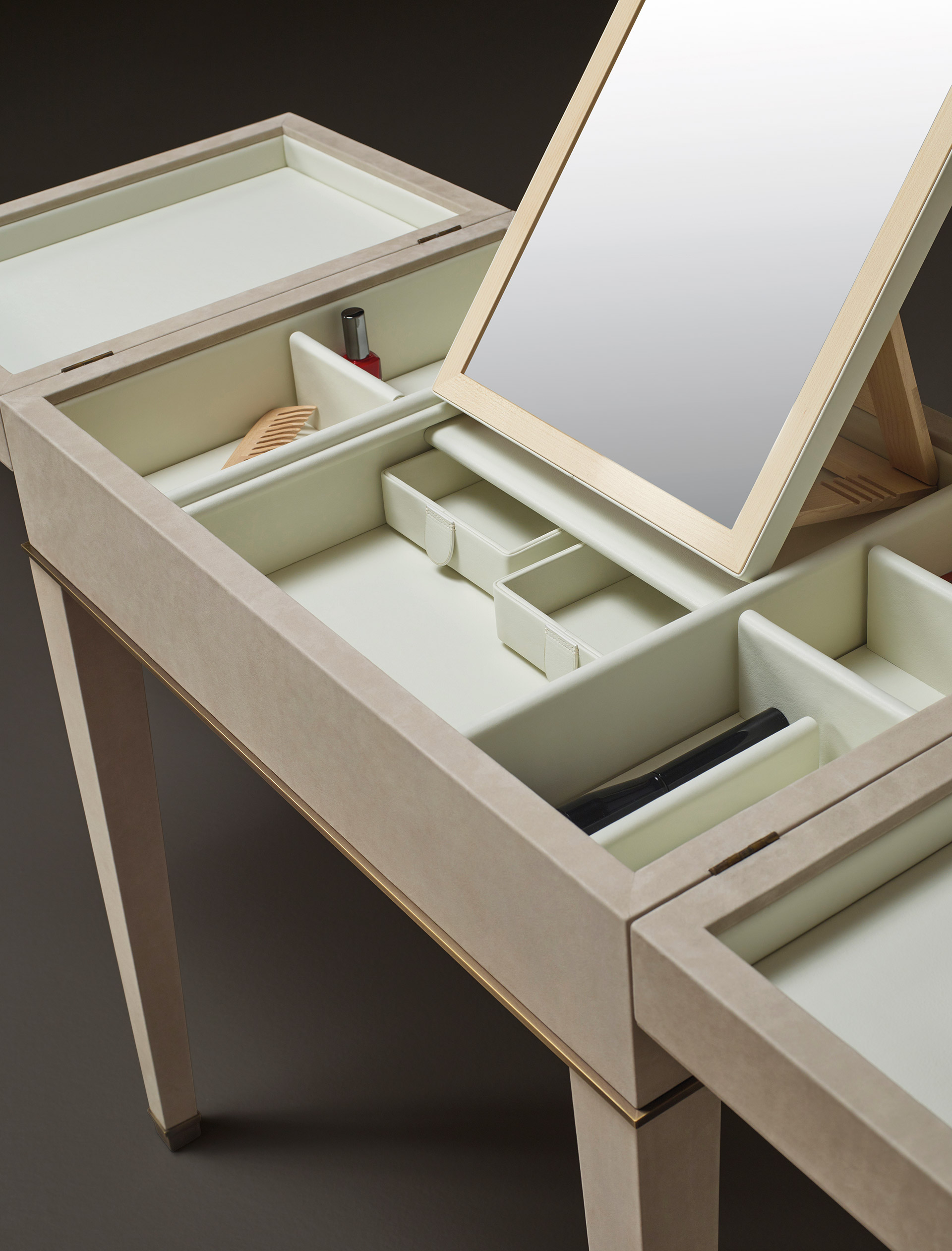 Inside detail of Kalypso, a wooden cabinet with bronze and leather details from Promemoria's collection Amaranthine Tales | Promemoria