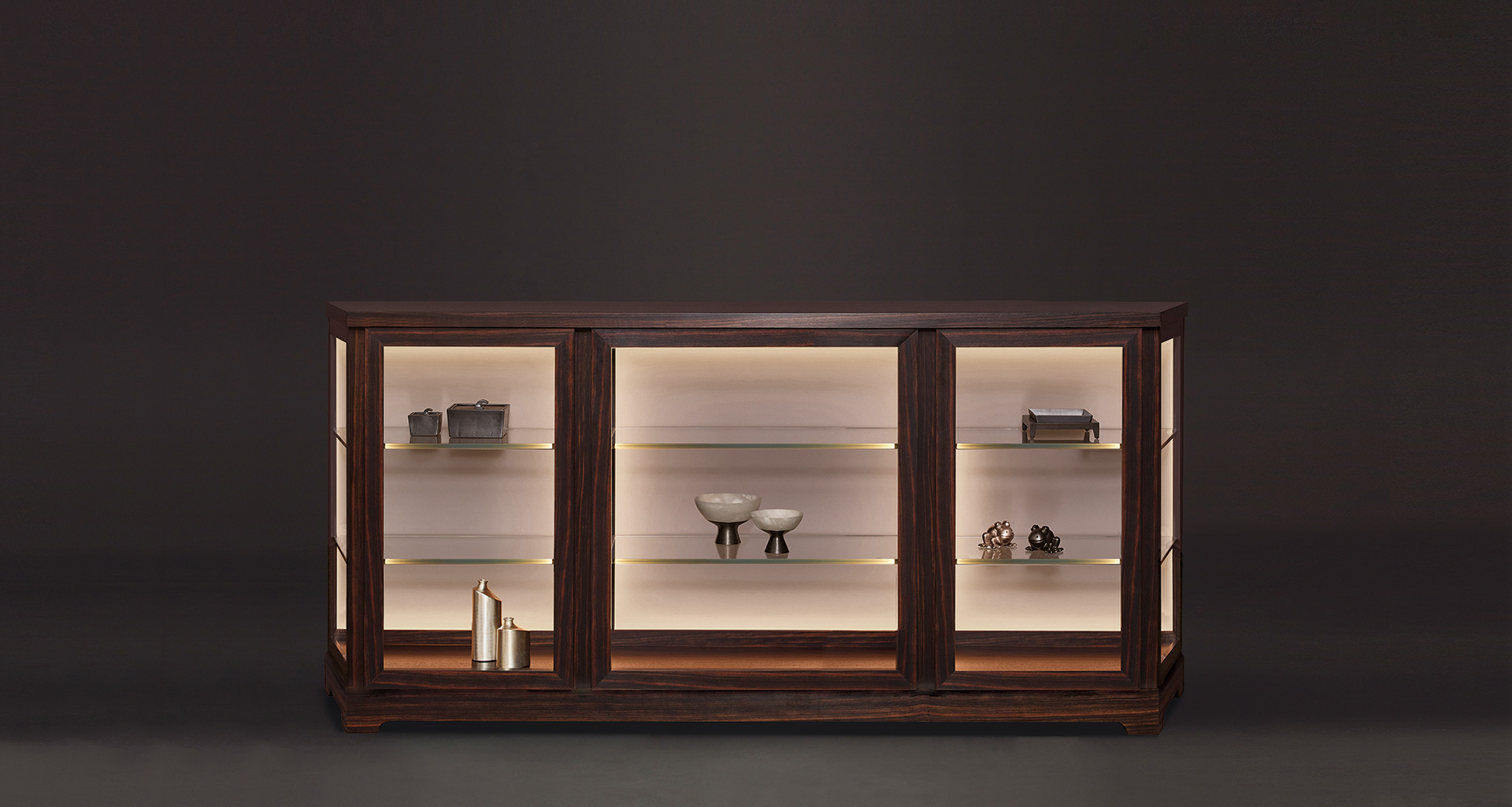 Nefertiti is a wooden cabinet with glass and bronze details from Promemoria's Night Tales collection | Promemoria