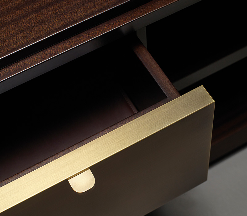 Nightwood is a wooden low cabinet with drawers with bronze details and leather placemats from Promemoria's Amaranthine Tales collection | Promemoria