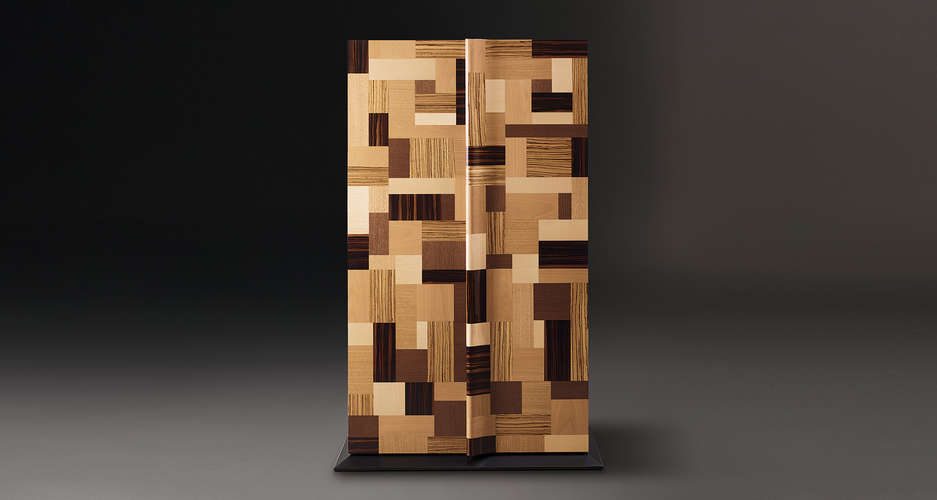 Oleandra is a wooden cabinet that can have a geometric patchwork design with light and dark woods interweaved and bronze details from Promemoria's catalogue | Promemoria