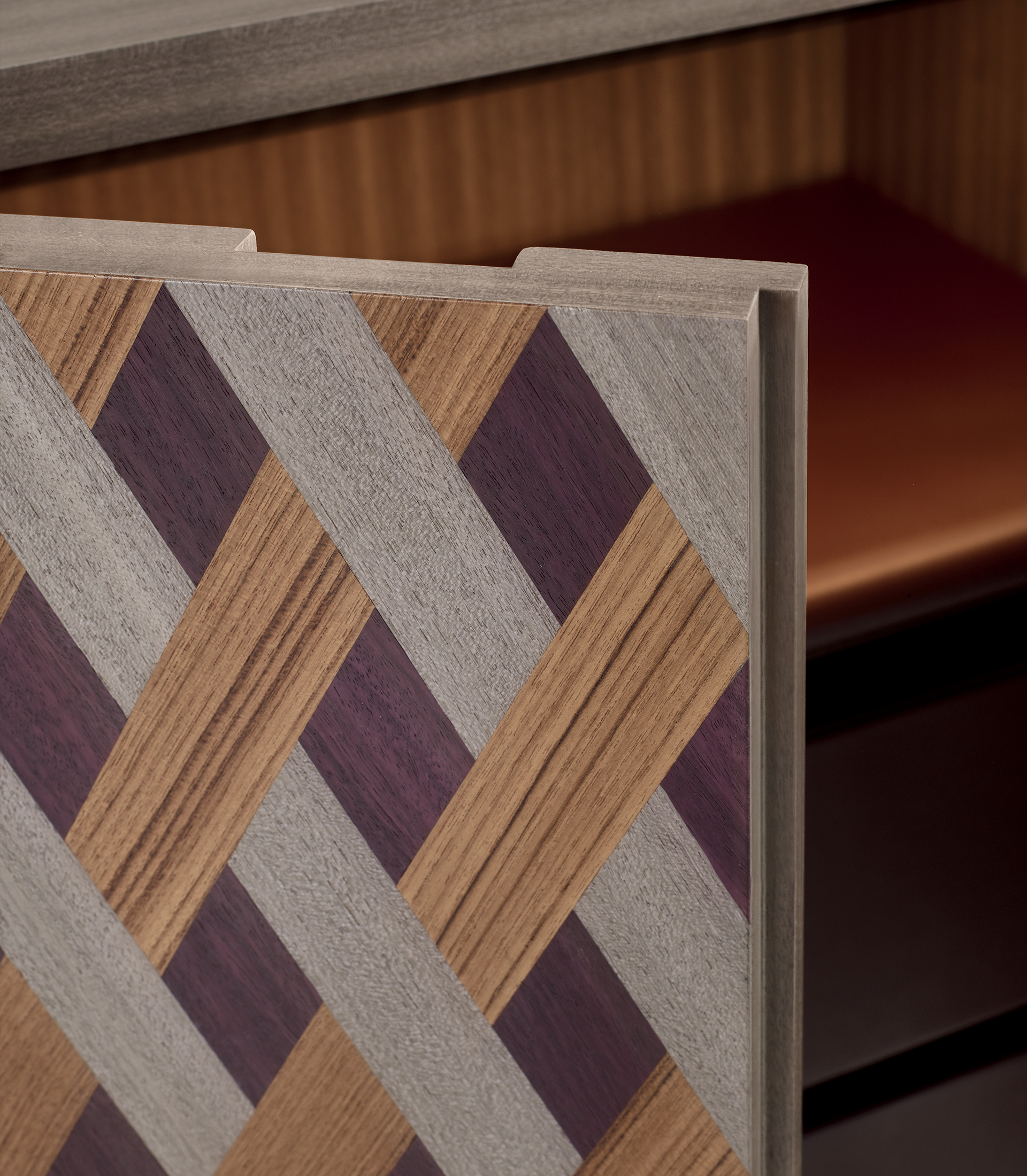 Detail of Amarcord in light grey mahogany with doors inlaid in amaranth wood, light grey mahogany and teak. 