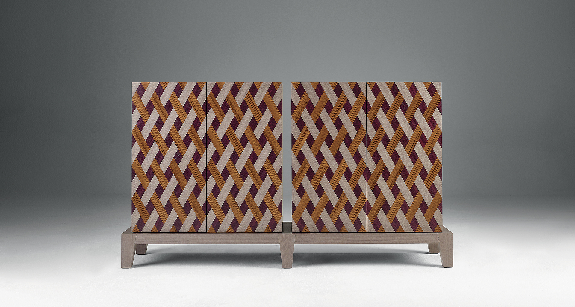 Detail of Amarcord in light grey mahogany with doors inlaid in amaranth wood, light grey mahogany and teak. 