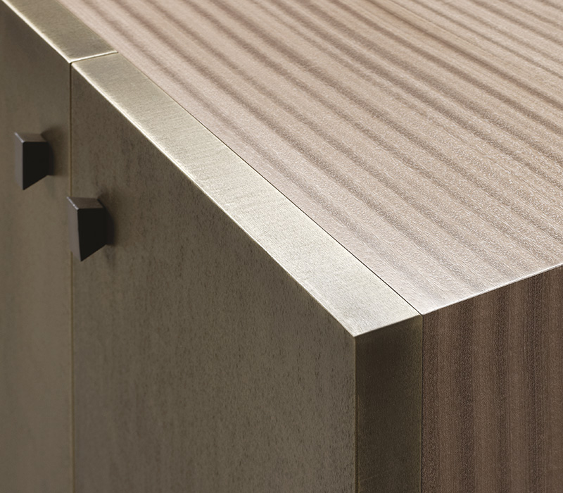 Detail of the bronze doors and handles of Amarcord is a wooden modular cabinet with doors or drawers from the Promemoria's catalogue | Promemoria