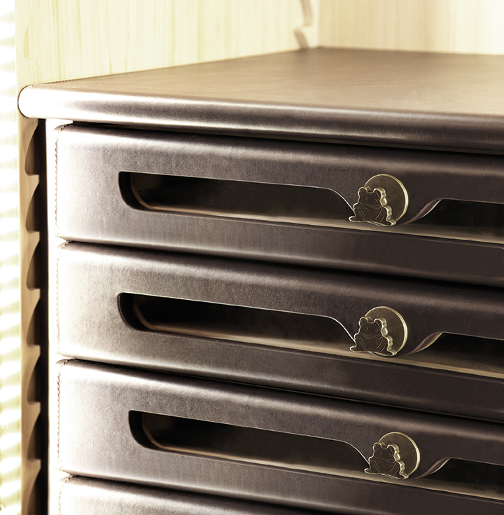 Inside drawers of George, a wooden modular wardrobe with two, three or four doors covered in velvet or linen and details in bronze, from the Promemoria's catalogue | Promemoria