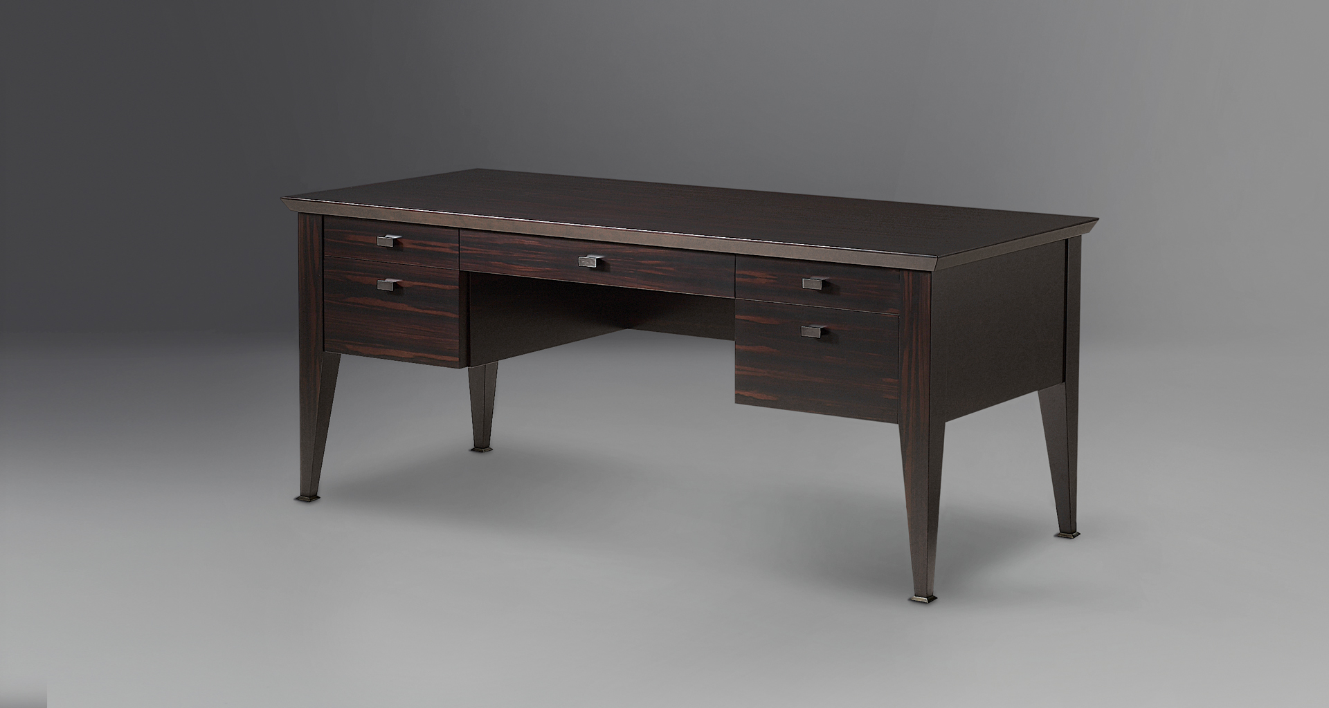 Theo is a wooden writing desk that can be covered in leather with leather details or with bronze details from the Promemoria's catalogue | Promemoria