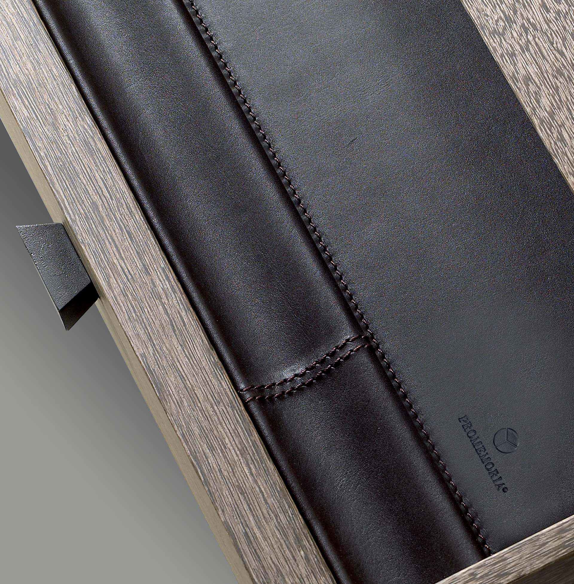 Theo is a wooden writing desk that can be covered in leather with leather details or with bronze details from the Promemoria's catalogue | Promemoria