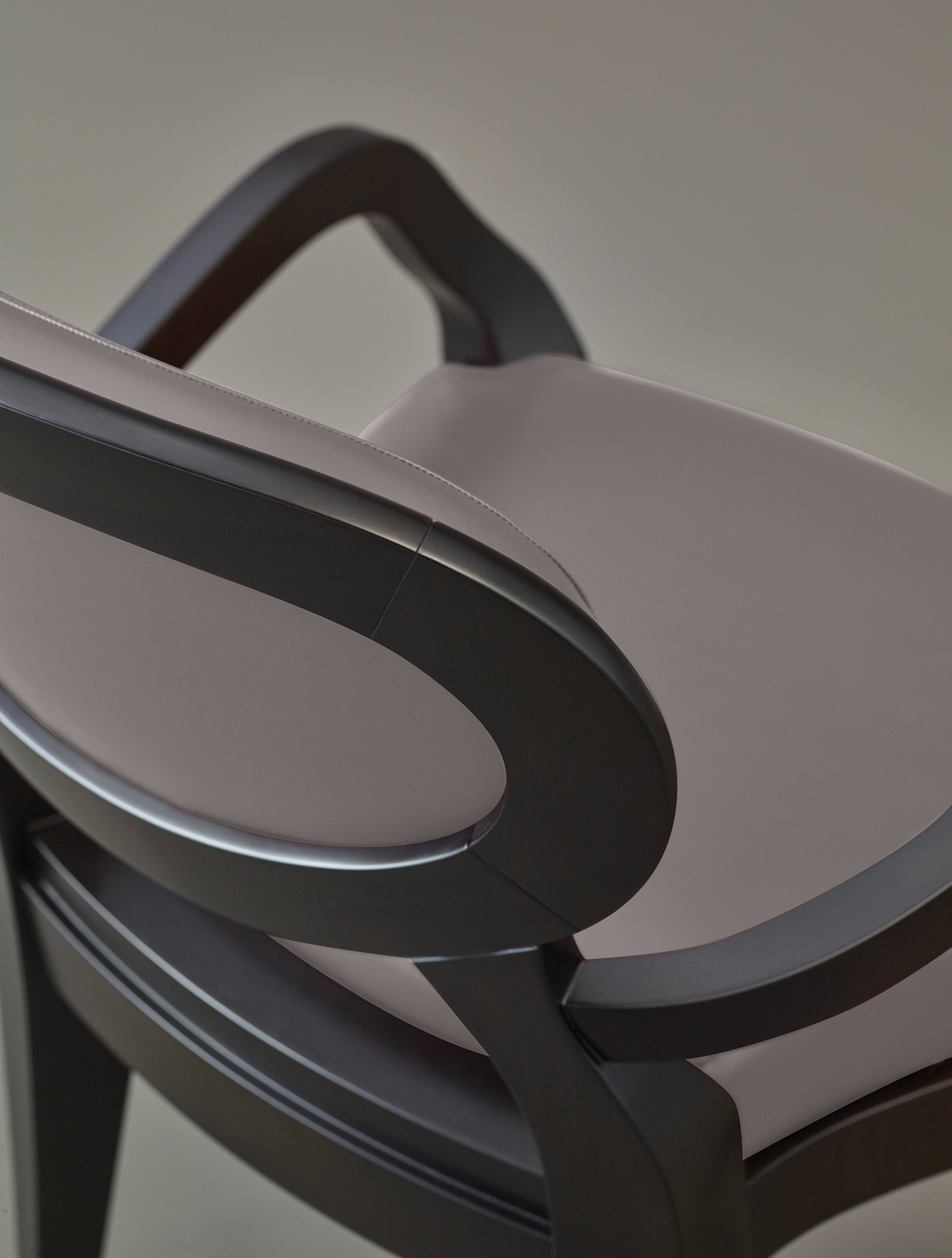 Detail of Anima, a wooden and fabric or leather dining chair available with different combinations of fabrics and colors, from Promemoria's catalogue | Promemoria