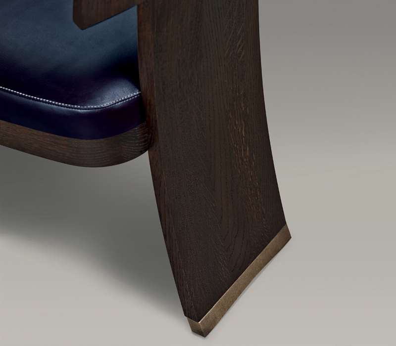 Detail of DC Chair, a wooden dining chair with leather seat and back and bronze feet, from Promemoria's The London Collection | Promemoria