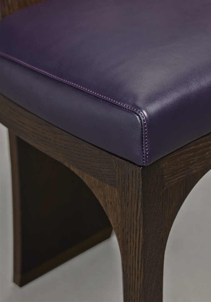 Detail of DC Chair, a wooden dining chair with leather seat and back and bronze feet, from Promemoria's The London Collection | Promemoria