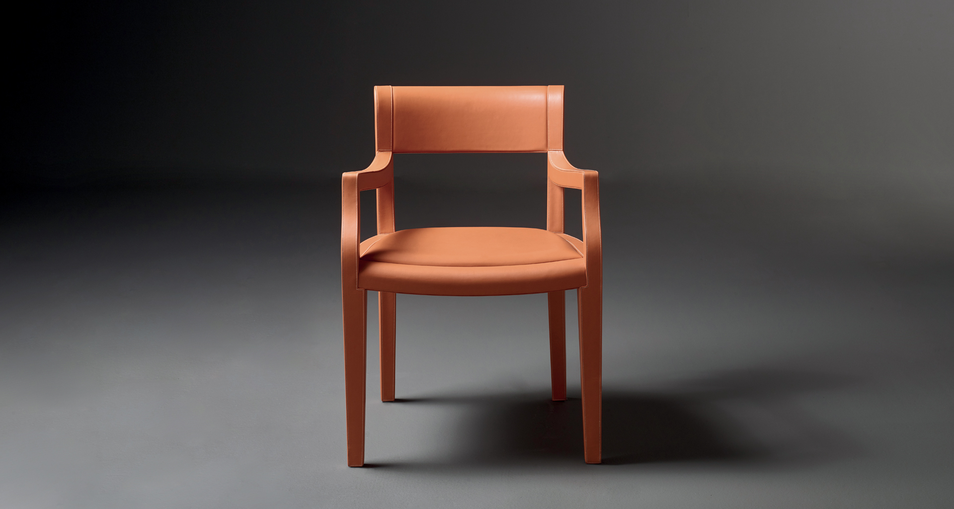 Eloise is a wooden dining chair with leather seat, available with or without armrests from Promemoria's catalogue | Promemoria