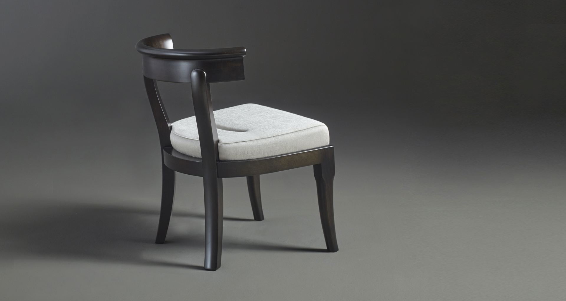 Irene is a wooden dining chair with a semi-circle backrest, from Promemoria's catalogue | Promemoria
