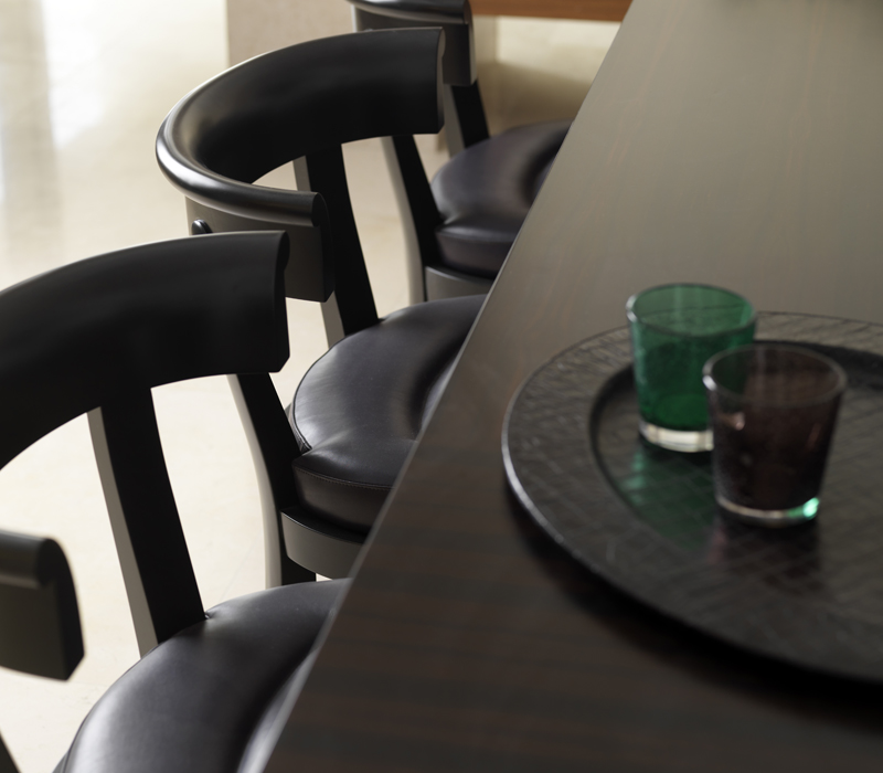 Irene is a wooden dining chair with a semi-circle backrest, from Promemoria's catalogue | Promemoria