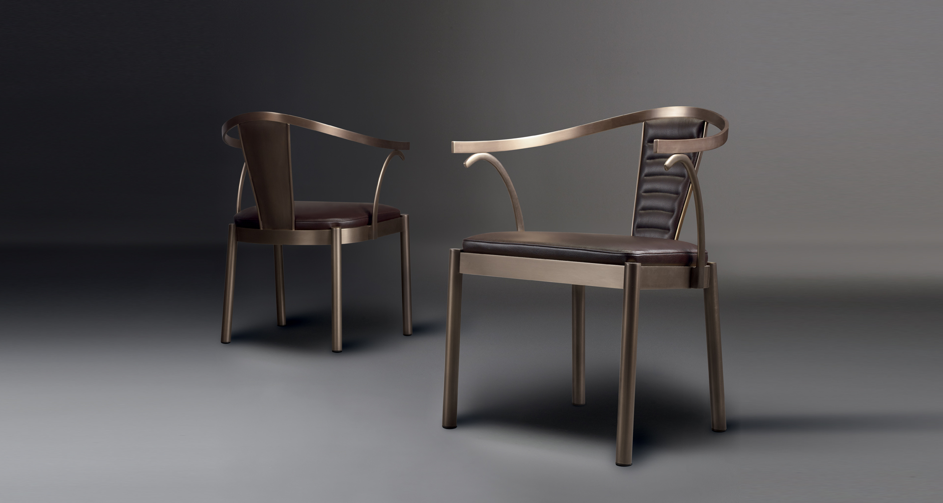 Jasmine is a bronze dining chair with armrests covered in leather, from Promemoria's catalogue | Promemoria