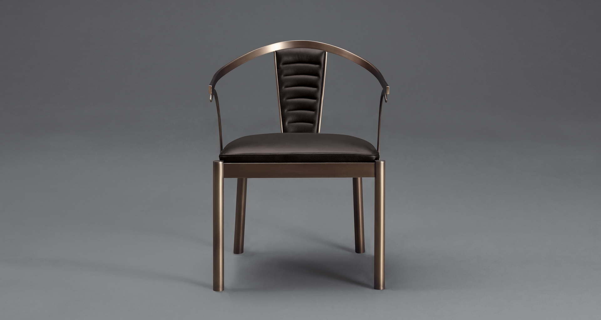 Detail of Jasmine, a bronze dining chair with armrests covered in leather, from Promemoria's catalogue | Promemoria