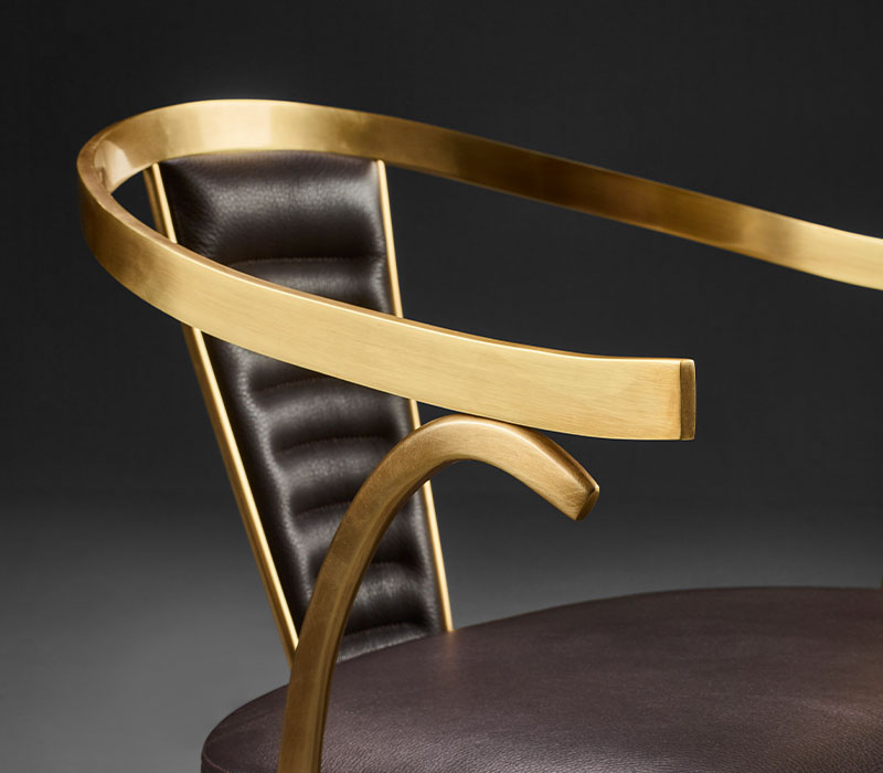 Detail of Jasmine, a bronze dining chair with armrests covered in leather, from Promemoria's catalogue | Promemoria