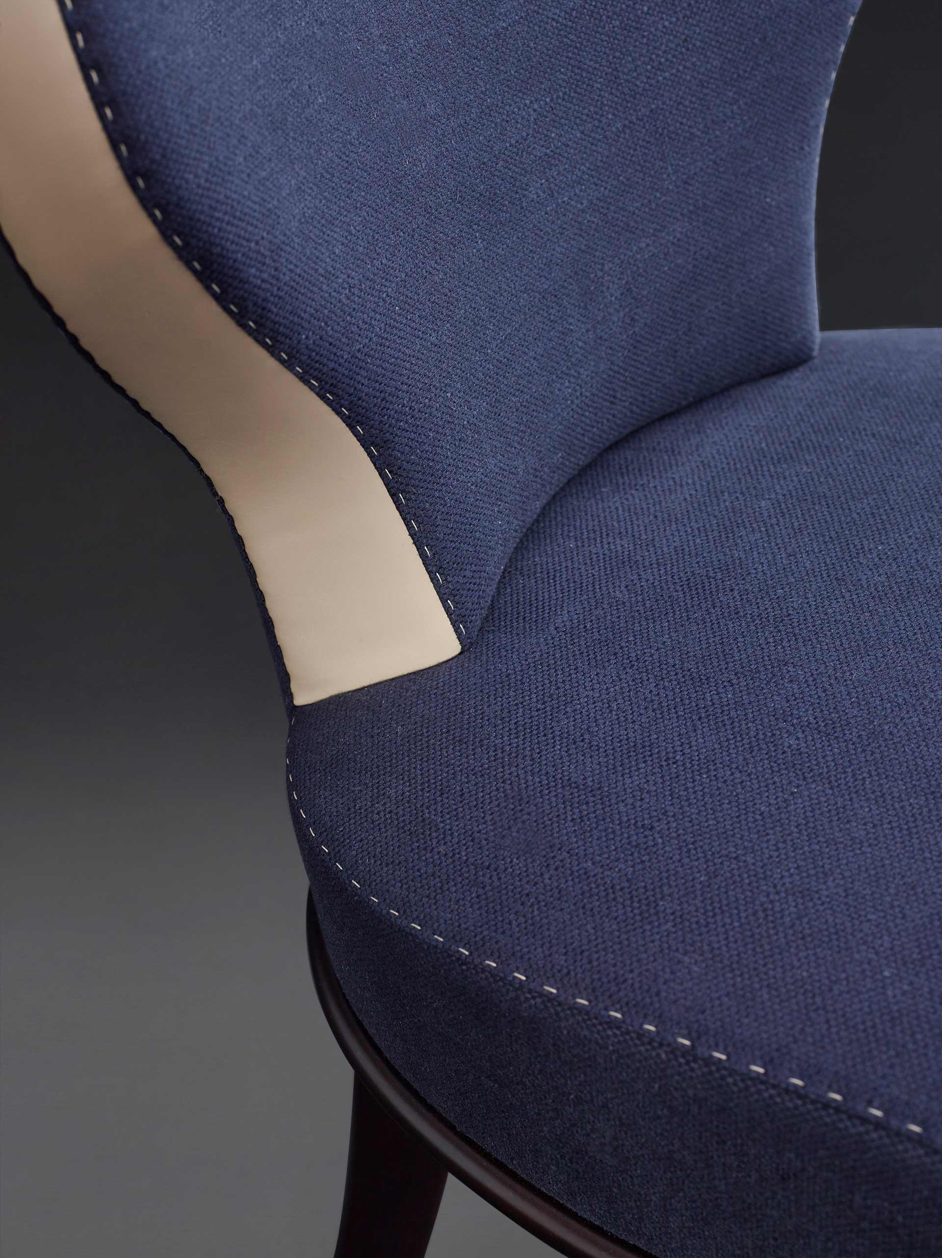 Detail of Moka, wooden chair covered in fabric and leather, with or without bronze armrests, from Promemoria's catalogue | Promemoria