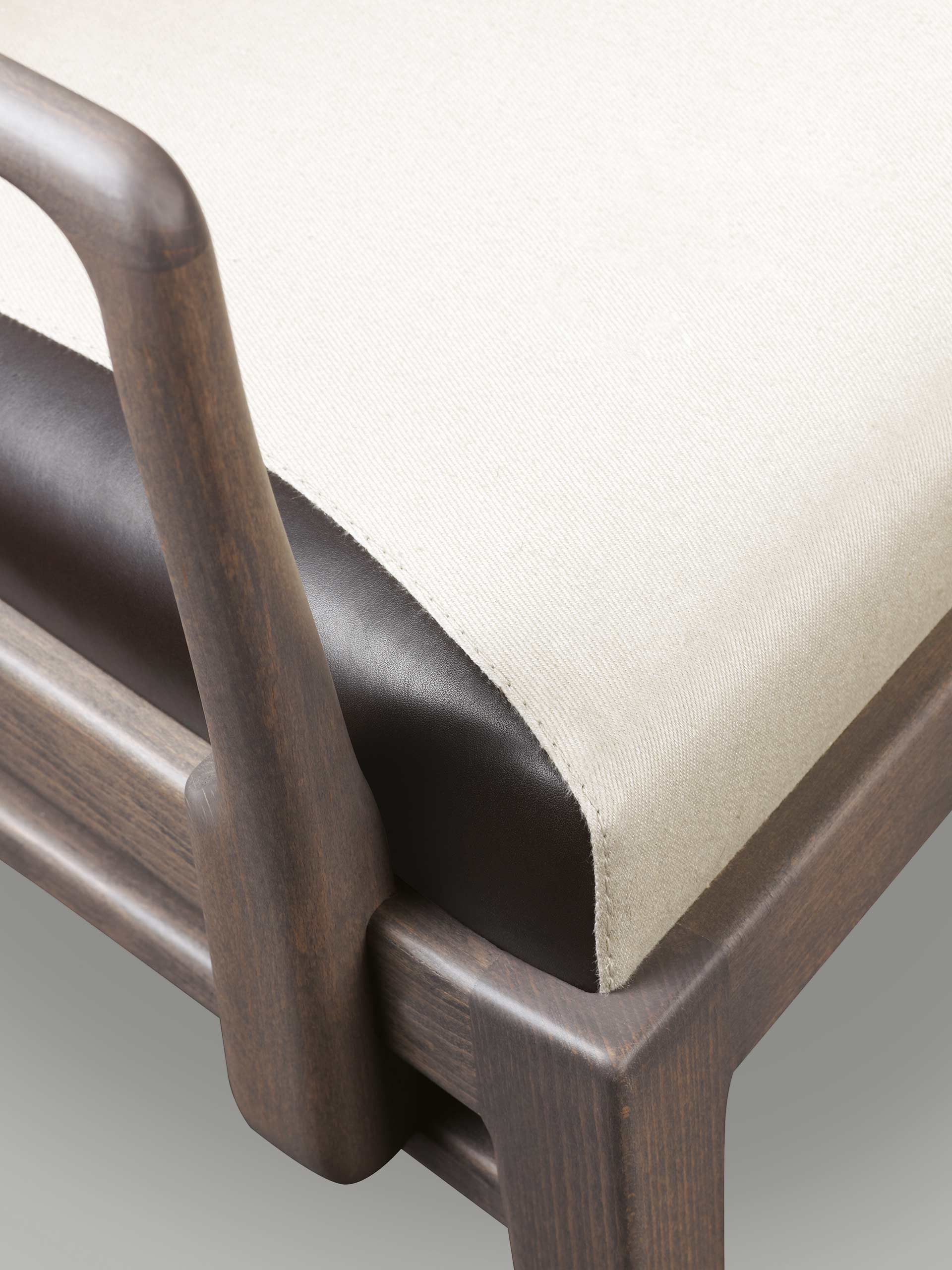 Detail of Pepita, a wooden dining chair with fabric or leather seat, from Promemoria's catalogue | Promemoria