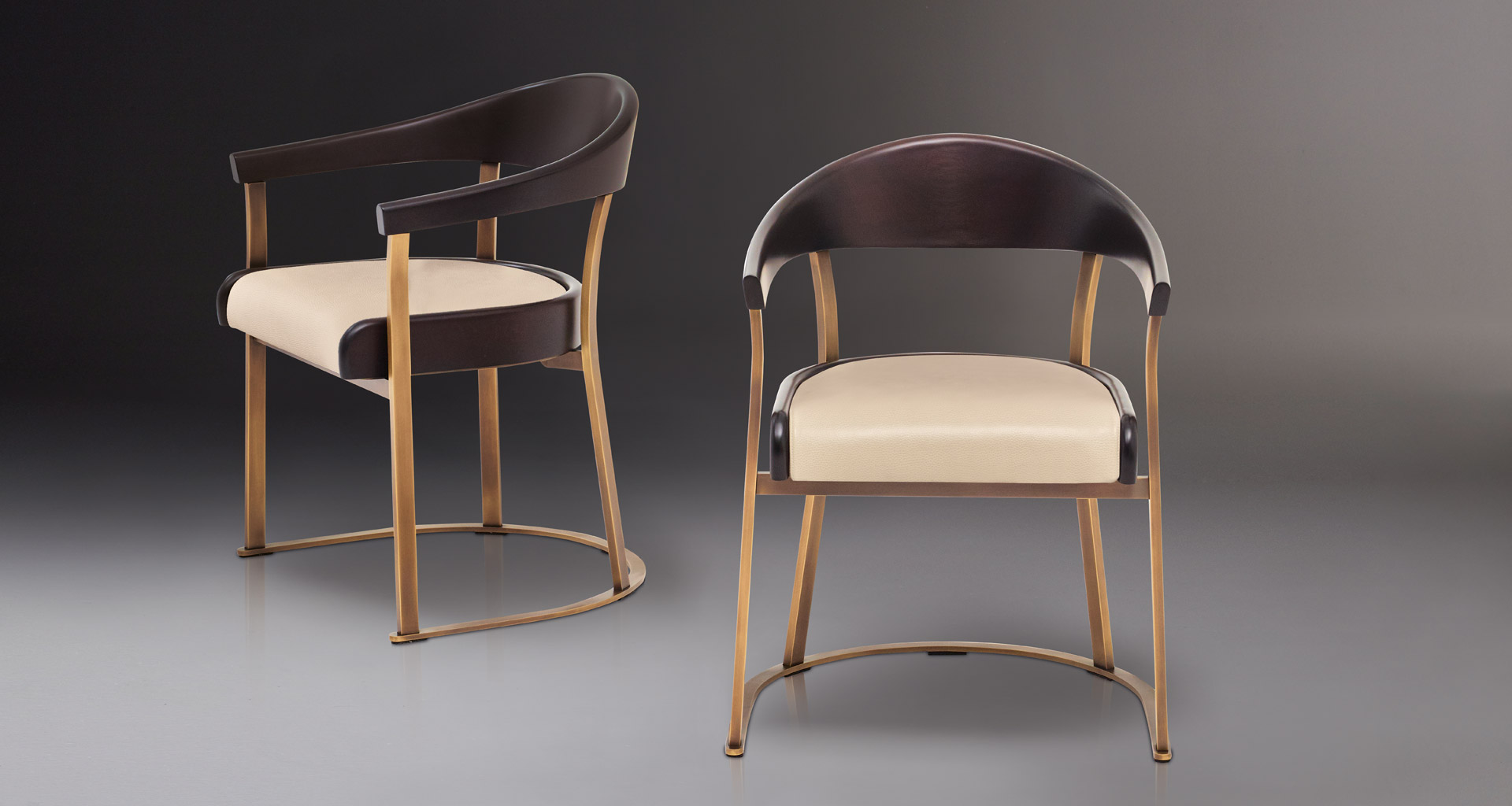 Rachele is a bronze chair with arms with wooden or leather back and leather seat, from Promemoria's catalogue | Promemoria