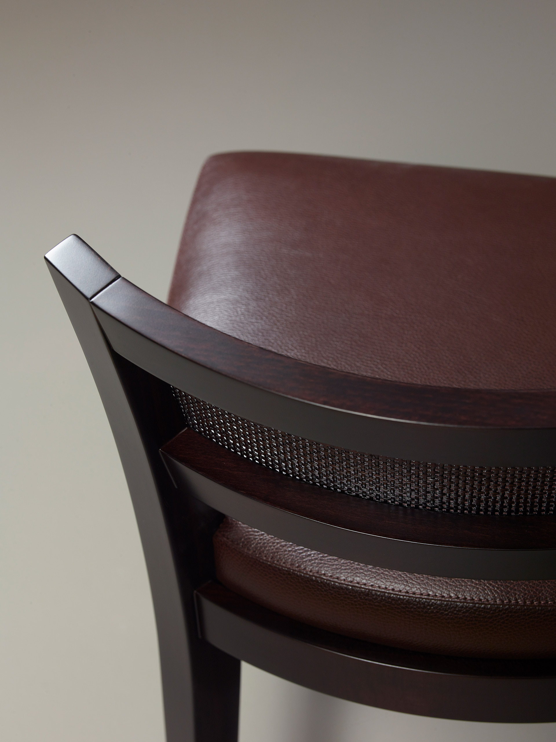 Detail of Caffè, a wooden stool with straw back and fabric or leather seat, from Promemoria's catalogue | Promemoria