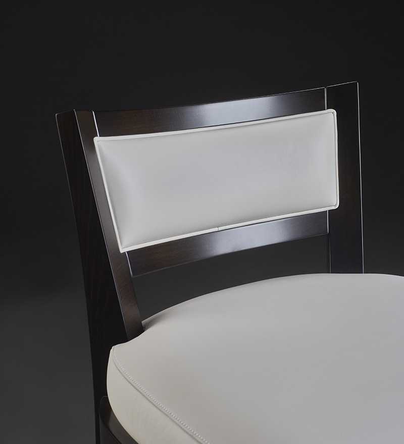 Detail of Caffè, a wooden stool with straw back and fabric or leather seat, from Promemoria's catalogue | Promemoria