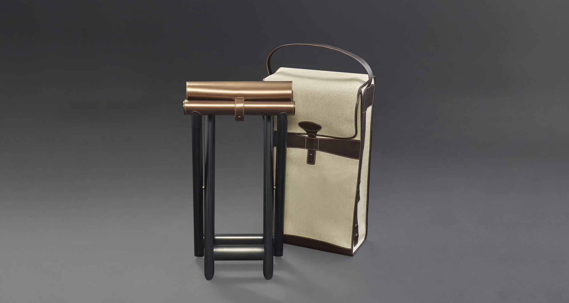 Petit Nyx and Grand Nyx are two folding wooden stools with bronze details and leather seat, from Promemoria's Night Tales collection | Promemoria