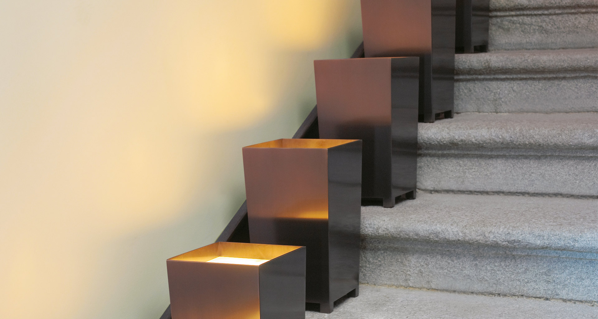 Bronzo is a floor LED lamp with bronze structure, covered inside with gold leaf and glass diffuser, from Promemoria's catalogue | Promemoria