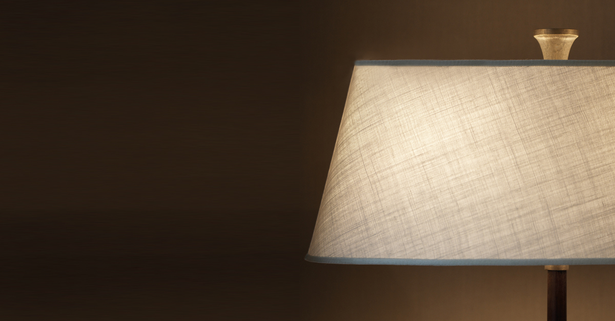 Rita is a floor LED lamp with a wooden strucutre, a bronze base and a linen, cotton or hand-embroidered silk lampashade, from Promemoria's catalogue | Promemoria