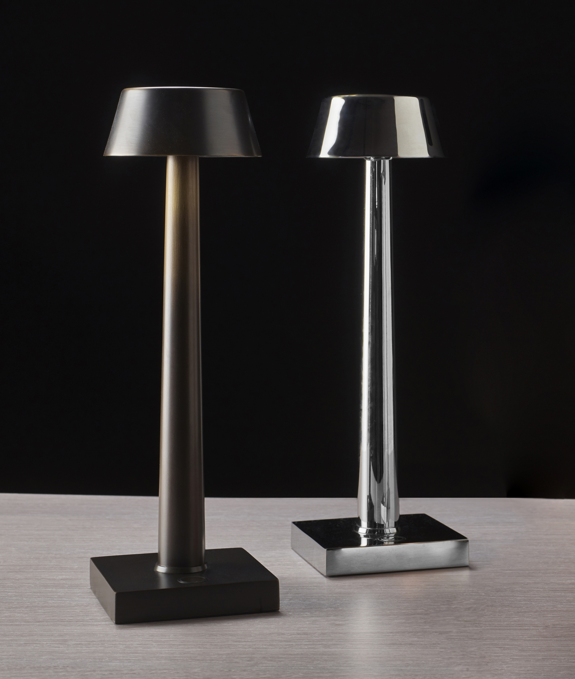 Fiammetta is a portable table LED lamp with bronze structure and touch switch, from Promemoria's catalogue | Promemoria