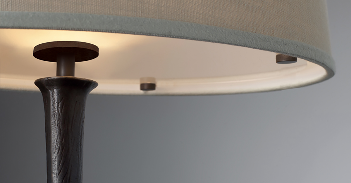 Françoise is a table LED lamp with bronze structure and linen, cotton or hand-broidered silk lampshade, from Promemoria's catalogue | Promemoria
