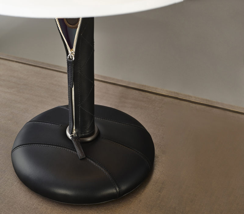 Leather covering detail of Zip is a table LED lamp with wooden structure and linen, cotton or silk lampshade with handmade edge, from Promemoria's catalogue | Promemoria