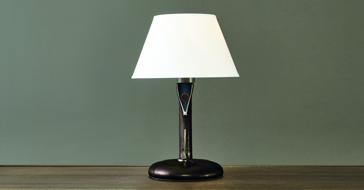 Zip is a table LED lamp with wooden structure or covered in leather and fabric with bronze details and linen, cotton or silk lampshade with handmade edge, from Promemoria's catalogue | Promemoria