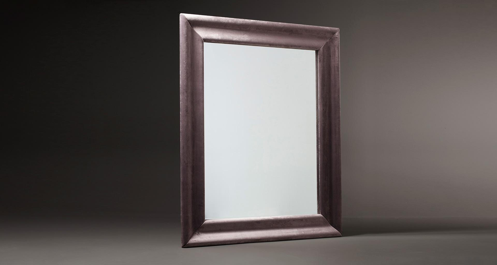 Michele is a large mirror with a wooden frame from the Promemoria's catalogue | Promemoria