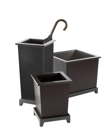 Santos are a wooden umbrella stand, flowerpot, wastepaper bin and tray, covered in leather, from Promemoria's catalogue | Promemoria