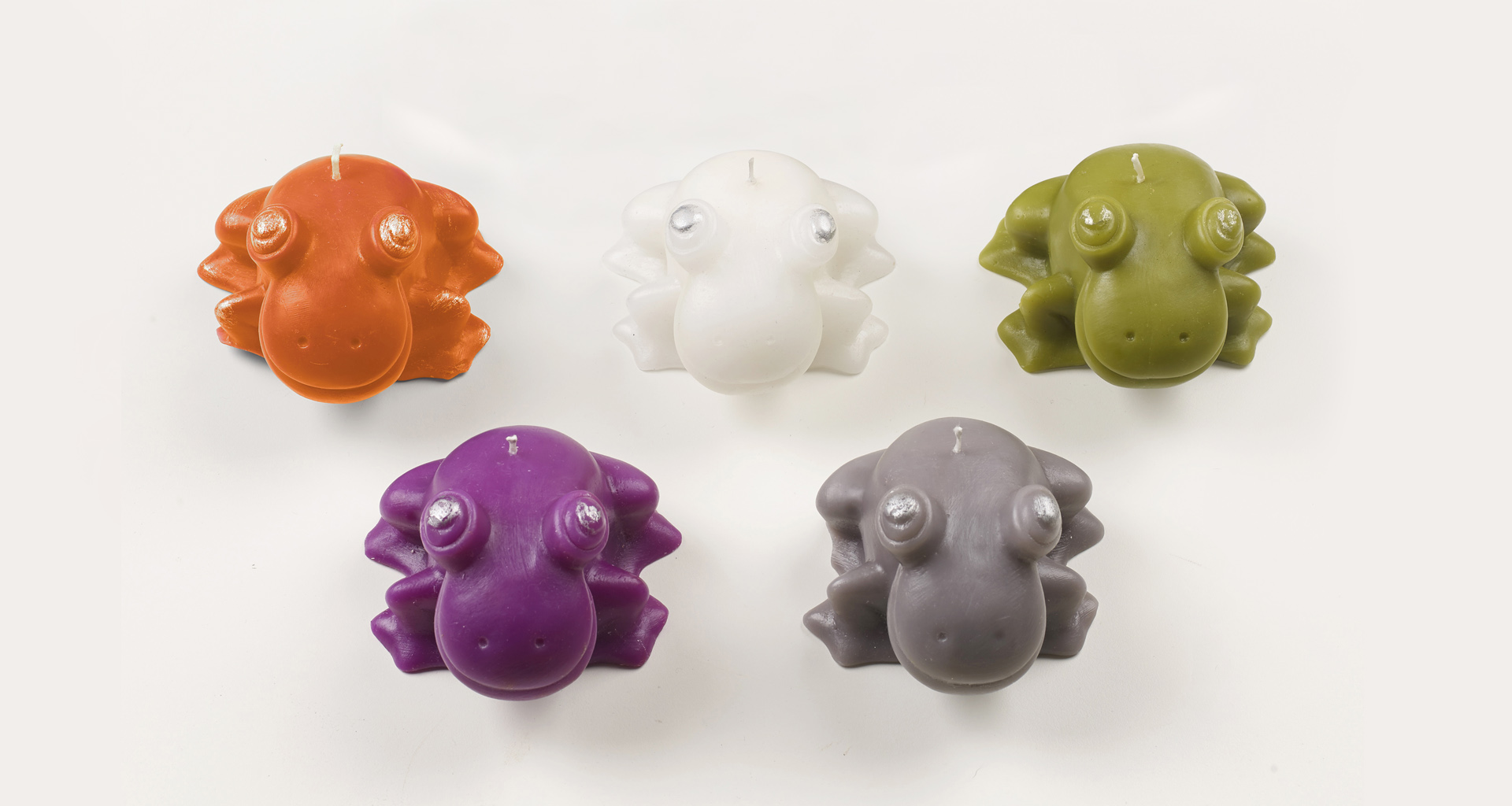 Rana Candela is a candle shaped like a frog, Promemoria's mascot, available in several colors, from Promemoria's catalogue | Promemoria
